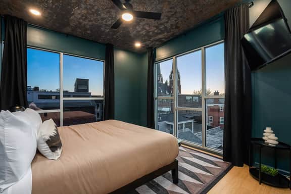 Bedroom 3 is on the 3rd floor, has a king bed and overlooks the rear yard and faces downtown.